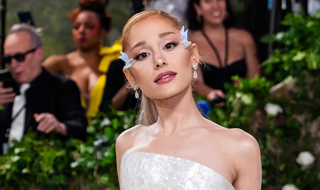 Ariana Grande posing in a white gown at the 2024 Met Gala