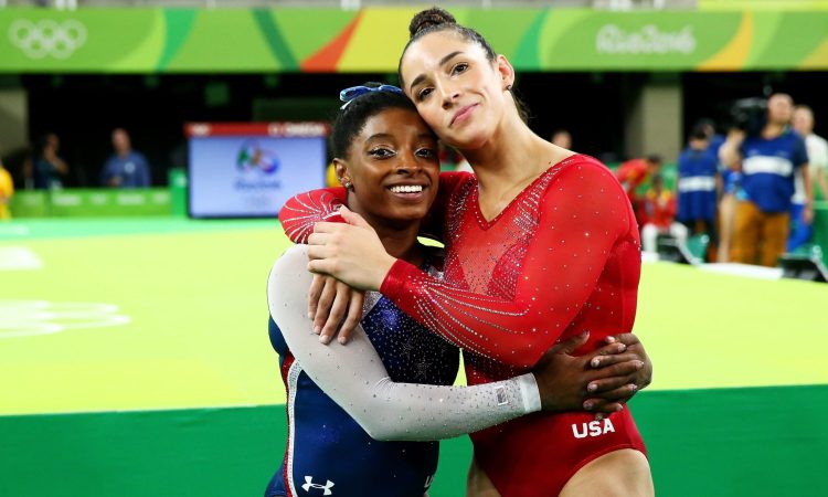 RIO DE JANEIRO, BRAZIL - AUGUST 11:  Simone Biles (L) of the United States waits for the score after competing on the floor with Alexandra Raisman (R) during the Women's Individual All Around Final on Day 6 of the 2016 Rio Olympics at Rio Olympic Arena on August 11, 2016 in Rio de Janeiro, Brazil.  (Photo by Alex Livesey/Getty Images)