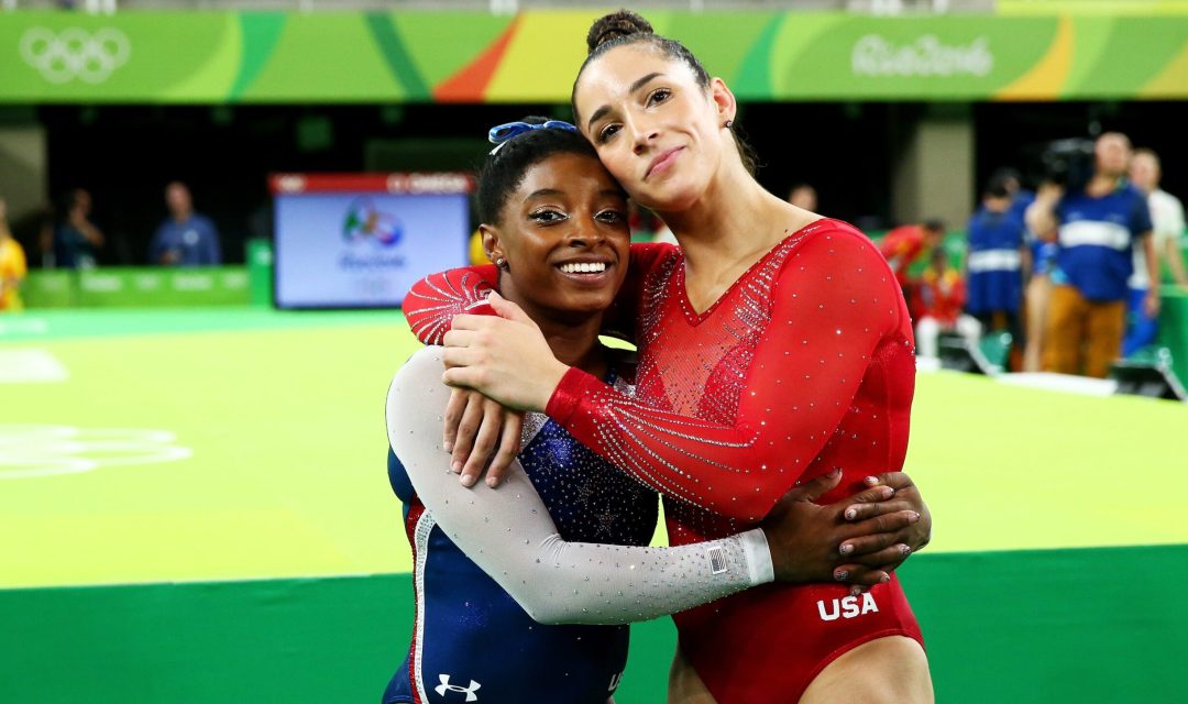 RIO DE JANEIRO, BRAZIL - AUGUST 11:  Simone Biles (L) of the United States waits for the score after competing on the floor with Alexandra Raisman (R) during the Women's Individual All Around Final on Day 6 of the 2016 Rio Olympics at Rio Olympic Arena on August 11, 2016 in Rio de Janeiro, Brazil.  (Photo by Alex Livesey/Getty Images)