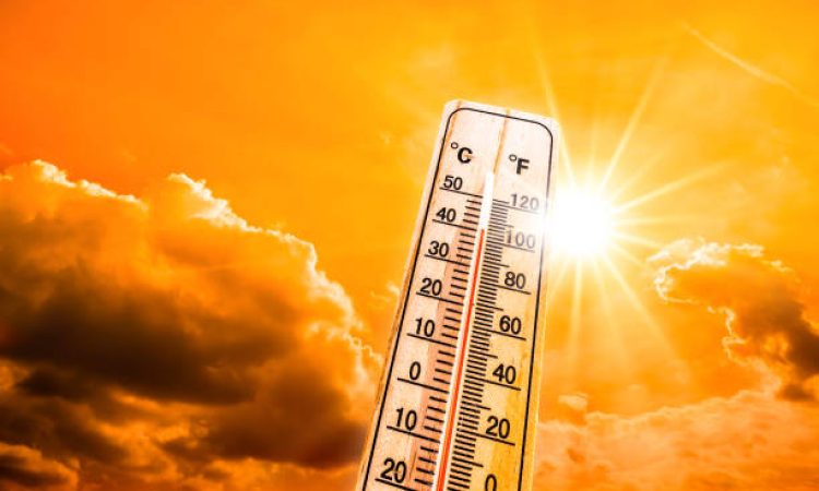 Hot summer or heat wave background, glowing sun on orange sky with thermometer