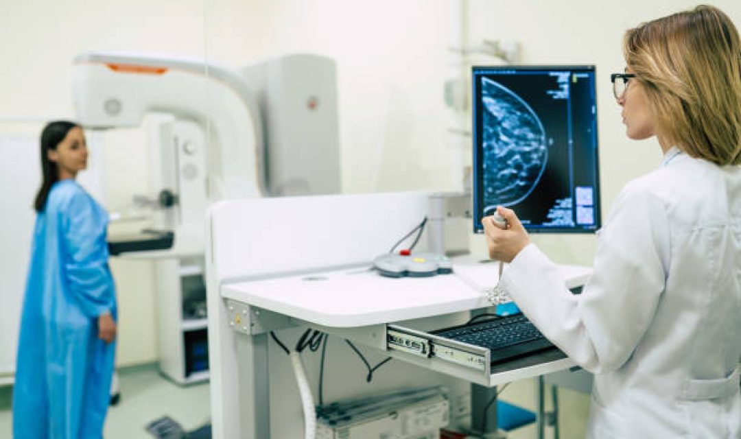 Young woman is having mammography examination at the hospital or private clinic with a professional female doctor.