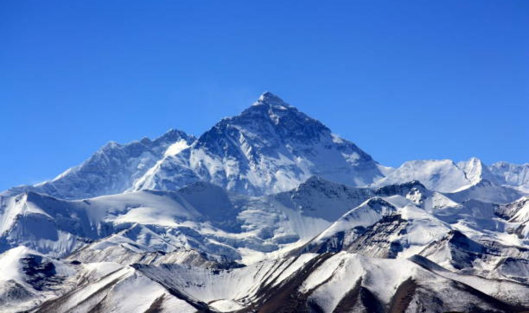 Scenic View Of Snowcapped Mountains Against Clear Blue Sky