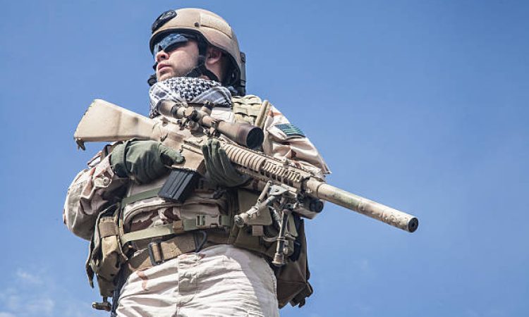 Member of Navy SEAL Team with weapons in action