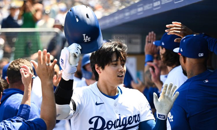 Apr 21, 2024; Los Angeles, California, USA; Los Angeles Dodgers designated hitter Shohei Ohtani (17) celebrates in the dugout with teammates after a home run against the New York Mets during the third inning at Dodger Stadium. Mandatory Credit: Jonathan Hui-USA TODAY Sports